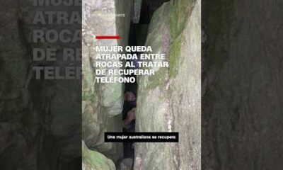 Mujer queda atrapada entre rocas al tratar de recuperar el teléfono