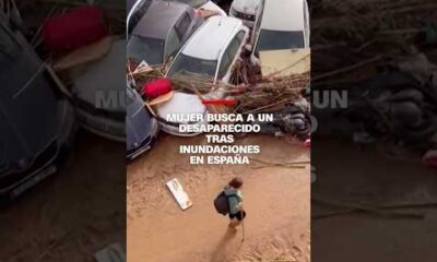 Mujer busca a un desaparecido tras inundaciones en España